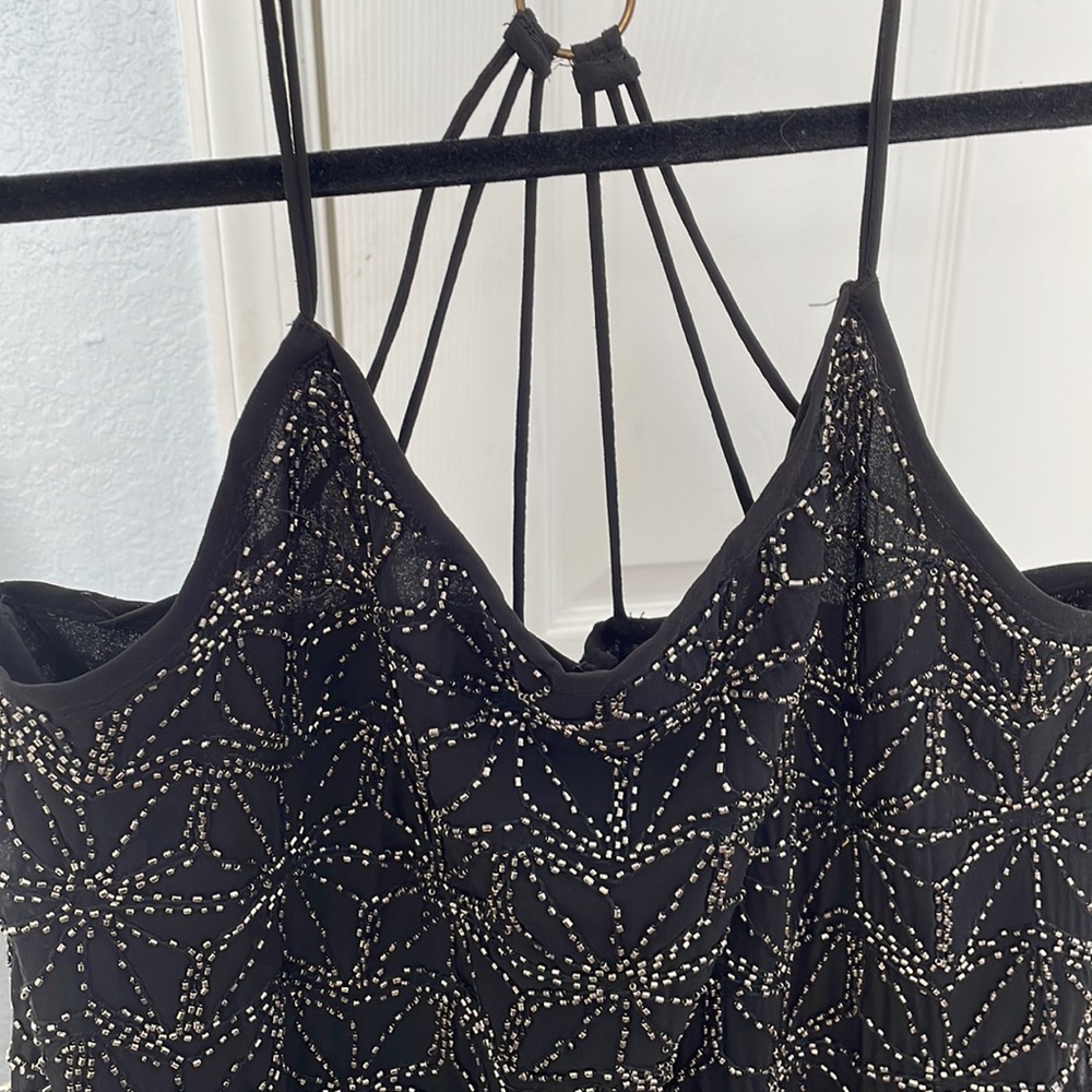 Hand-beaded little black dress perfect for a night out or special occasion.